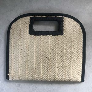 Woven beige and black clutch